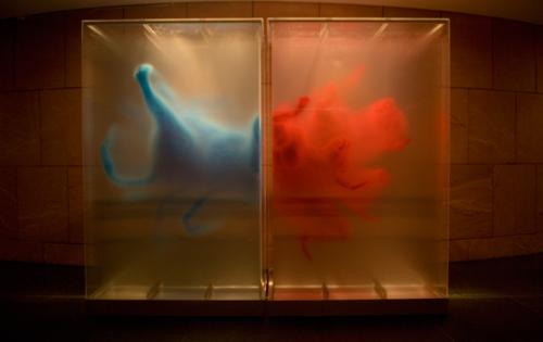 A work which on the left features and animal rear painted in blue on the left an explosion of red paint.