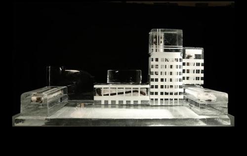 A architectural model of a building captured in an ice block. 