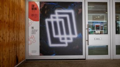 Closer up view of several overlapping rectangles of light on a dark background with blue and orange swirls.