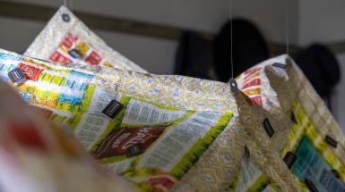 Closeup of soothing candy wrappers, teabags, etc. that make up the quilt.