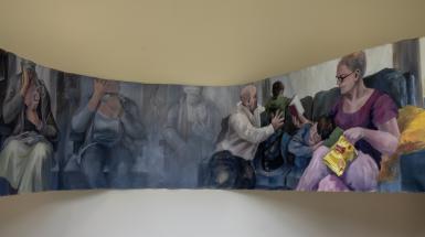 Long, undulating painting of many overlapping scenes.