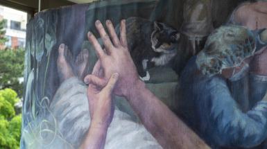 Closeup examining the fingers of one hand.