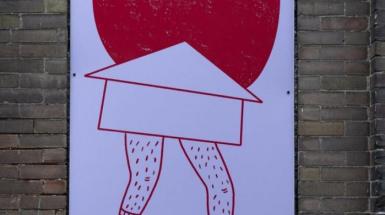 Legs coming from house the is on fire