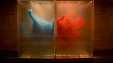 A work which on the left features and animal rear painted in blue on the left an explosion of red paint.