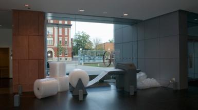 A machine that take big rolls of bubble wrap, on the left,  and pops it. 