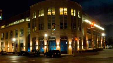 Building with blue light emitting from within.