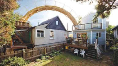 Large curved bridge that goes from one balcony to another