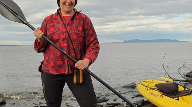 photo of  Lisa Myers holding kayak paddle 