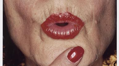 Red lips in puckered pose