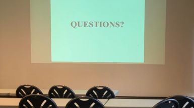 Projected image that says "QUESTIONS?"