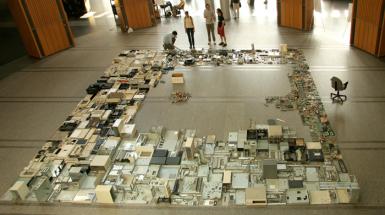 A large circuit board like sculpture that is around 3 meters squared