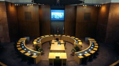 Projection video being played on wall of city council hall. 