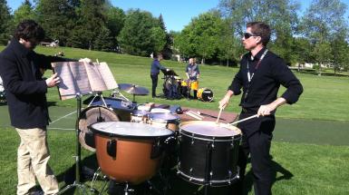 Man playing drums in park
