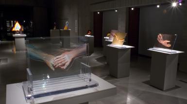 Image of glass work with tow x-ray hands hold each other 