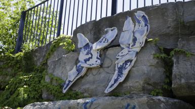 Ceramics on wall with blue and white designs 