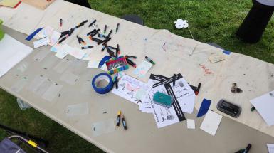 art materials scattered over table