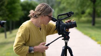 artist taking a photo with a large camera on a tripod