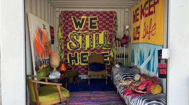 A sea can decorated to look like an bunker lived in by black people