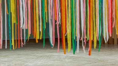 Close up of colourful ribbons hanging together.
