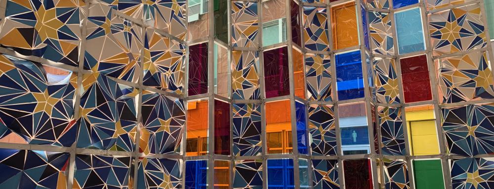 interior installation view with moquarnas pattern on thousands of painted shards and multicoloured plexiglass