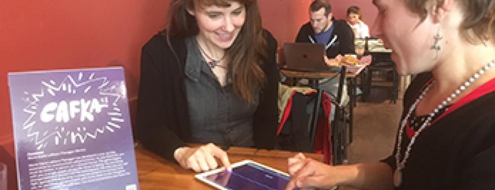 Two Woman interacting with common web app on ipad. 