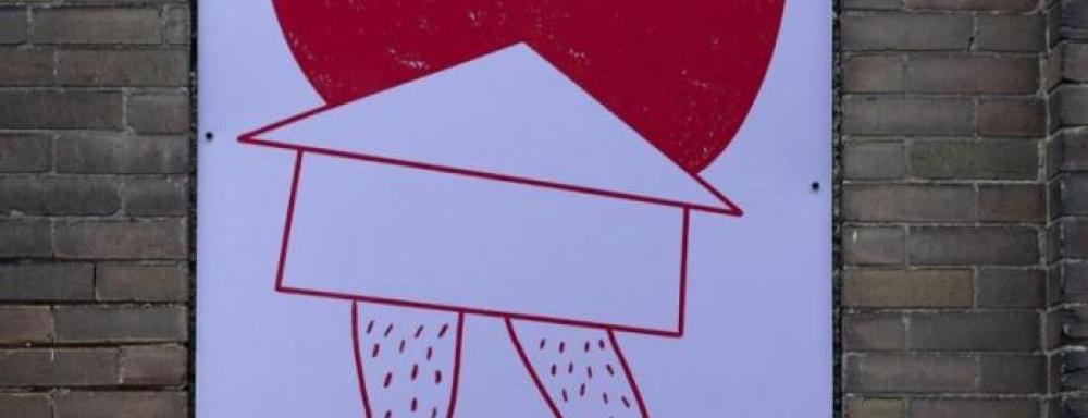 Legs coming from house the is on fire