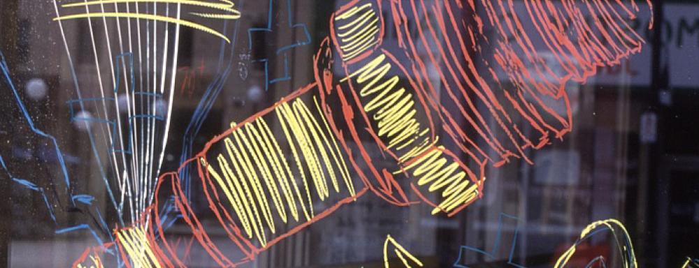 grease pencil drawings on glass of spark plug