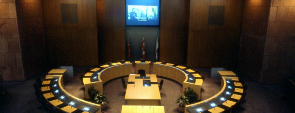 Projection video being played on wall of city council hall. 