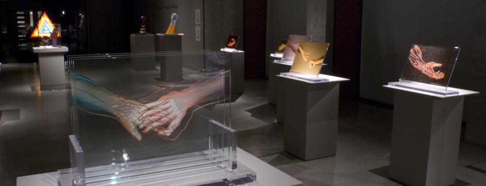 Image of glass work with tow x-ray hands hold each other 