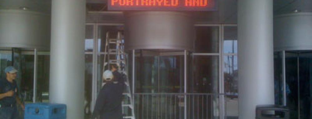 LED sign that reads "portrayed and"