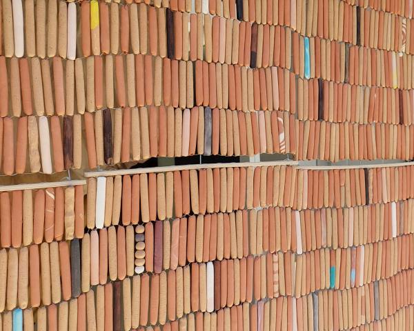 Image of a beaded clay curtain made by Abedar Kamgari.