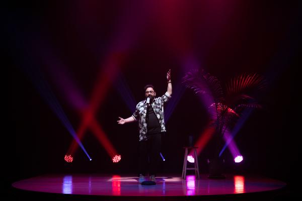 performance documentation of Izad on stage during a rehearsal