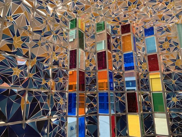 interior installation view with moquarnas pattern on thousands of painted shards and multicoloured plexiglass