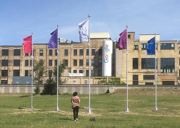 Photo of five flags outside google building 