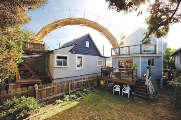 Large curved bridge that goes from one balcony to another