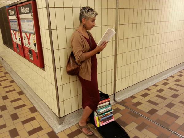 Individual reading book in subway station 