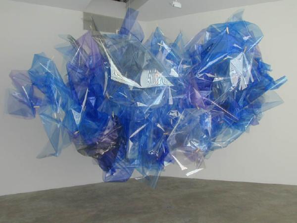 Sculpture of blue, purple and grey plastic sheets in cloud like shape
