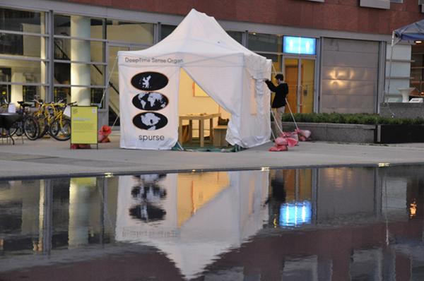 Photo of tent that says "deep time sense organ"