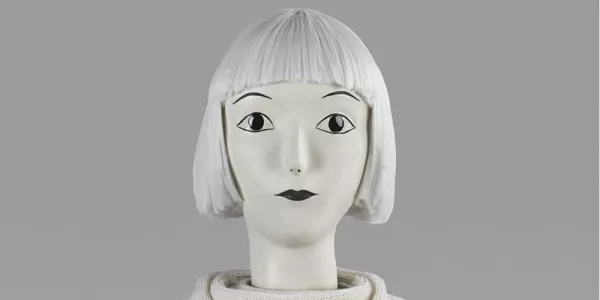 Sculpture "white elephant" of woman's head with white bob