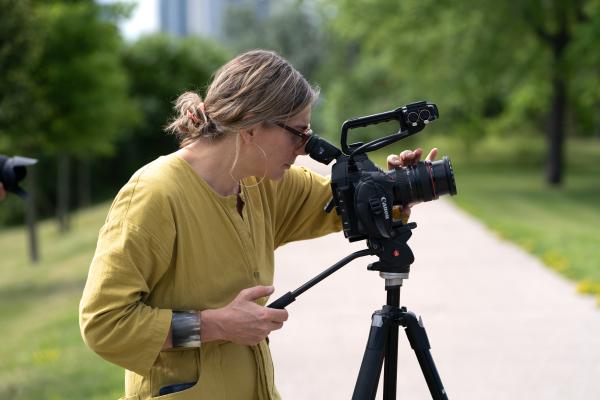 artist taking a photo with a large camera on a tripod
